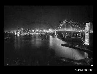 Negative depicting a night view of Sydney Harbour