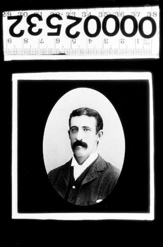 Photographic portrait of a man with a moustache