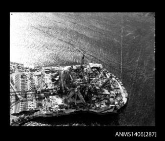 Negative depicting the Sydney Opera House under construction