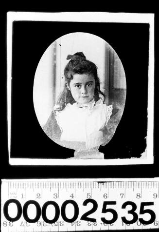 Portrait of a young girl wearing a white shirt vest with embroidery