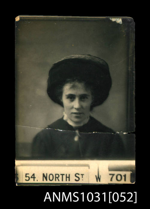 Woman wearing a dark coloured jacket and hat