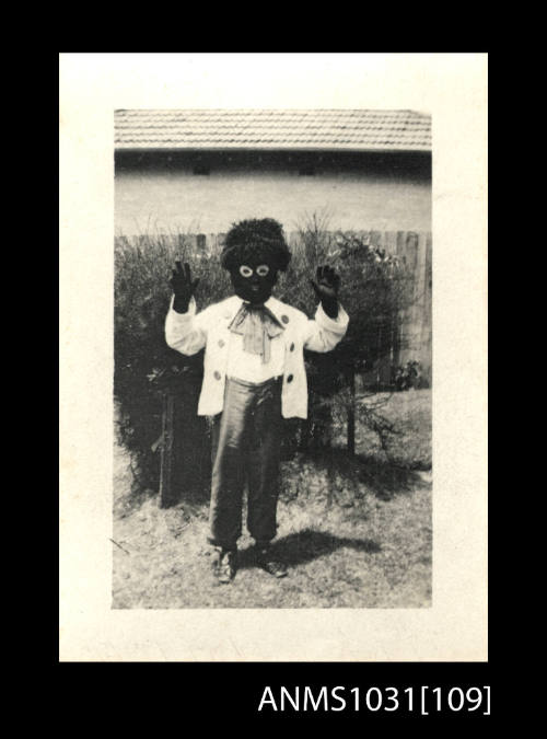 A person dressed up as a doll (Note this image contains offensive depictions of First Peoples and may cause trauma for people whose identities are directly impacted)