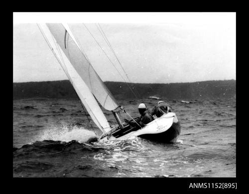 The image of CREST sloop rigged open sailing boat heeling over to port side