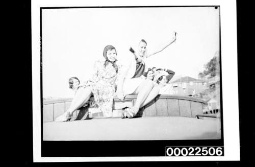 Women on the deck of a launch