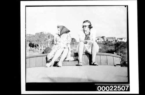 Two women on the deck of a launch