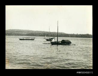 View of three anchored boats