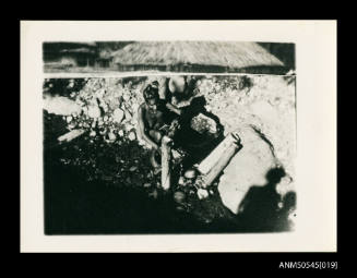 View of a woman working with logs