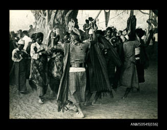 View of of people dancing under a tree