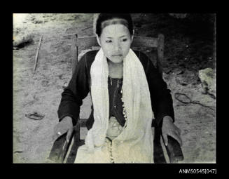 View of a girl sitting on a chair