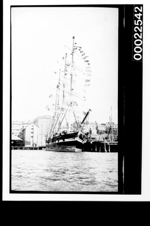 PORT JACKSON training ship - dressed all over docked at a wharf in Sydney Harbour