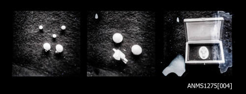 Three negatives, joined together, the first two possibly of half pearls, and the third of a cruciform shaped blister pearl in a box