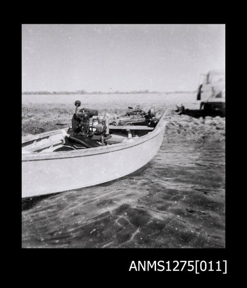 Negative of a boat in the water