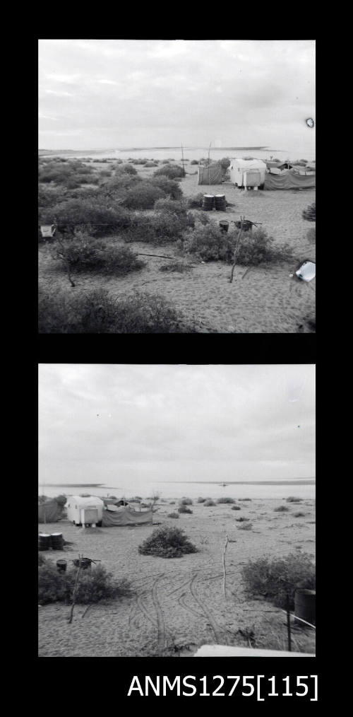 Two black-and-white negatives, joined together, both of shrubs, tents and cylindrical containers on the sand