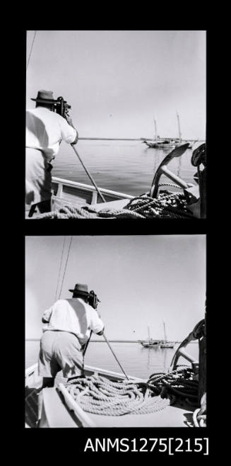 Two black-and-white negatives, joined together, both of  a man standing on a lugger, looking at a boat through a camera on a tripod