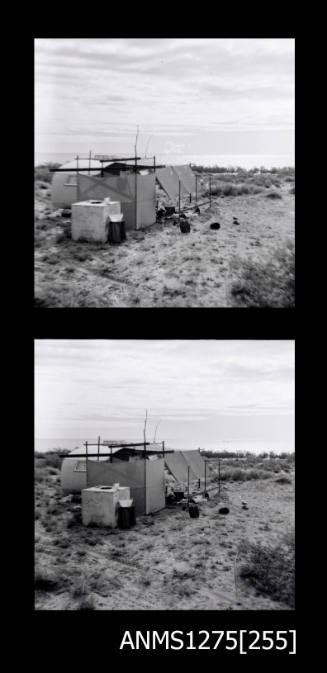 Two black-and-white negatives, joined together, both of a tent, equipment and a caravan on the beach