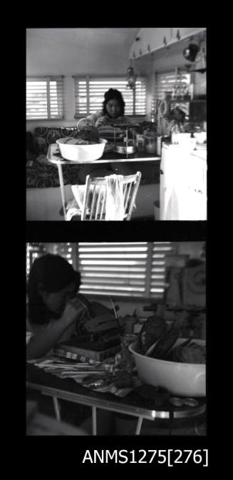 Yurie (or Yulie) George sitting at a desk seeding a pearl shell