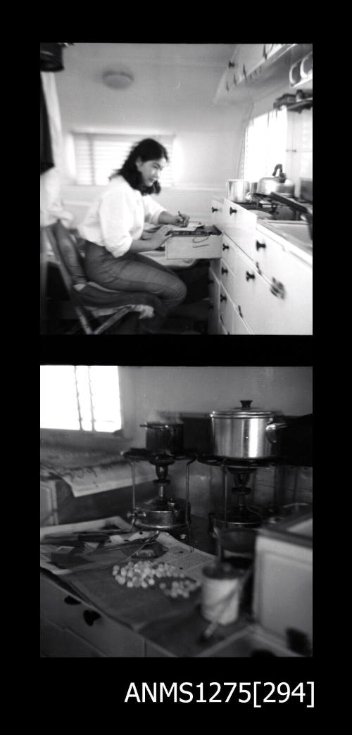 Two black-and-white negatives, joined together, the first of Yurie (or Yulie) George sitting, writing at an open drawer in a caravan, and the second of pearls and equipment sitting on a bench top