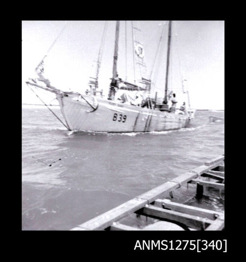 A side view of the boat RUBY DANA, with a pearl raft visible in the forefront