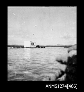 A shed next to the water on Packe Island