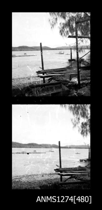 Two black-and-white negatives, joined together, both showing beach with equipment, and water, on Packe Island