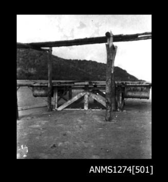 A wooden structure with metal containers attached, on Packe Island