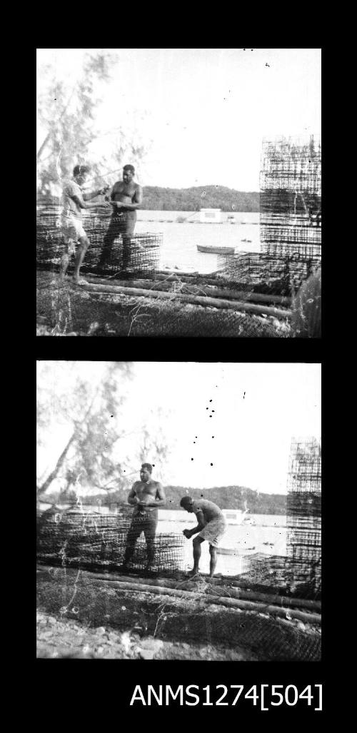 Two people standing near pearl cages on Packe Island