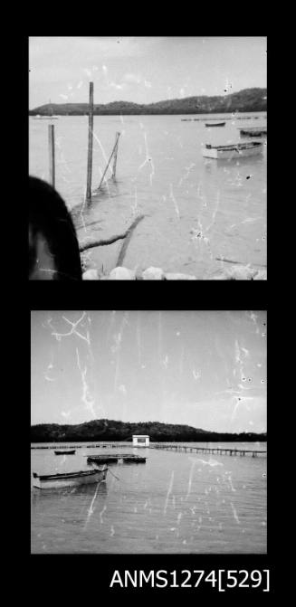 Two black-and-white negatives of a raft floating in shallow waters on Packe Island, taken from two different views