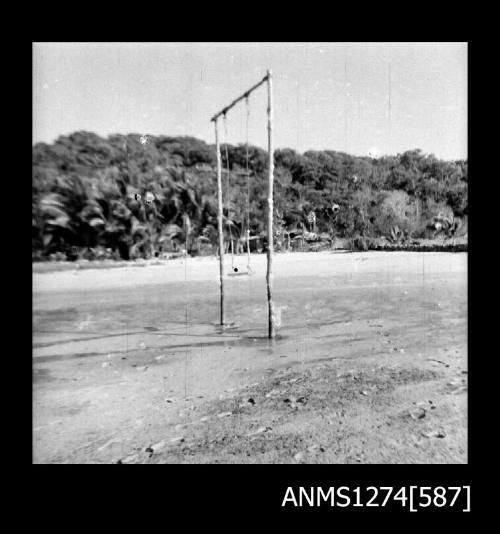 A wooden structure in the sand, similar to a swing, on Packe Island