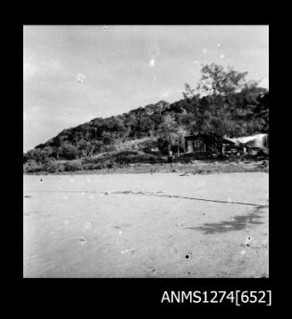 Shoreline on Packe Island, with a building under construction