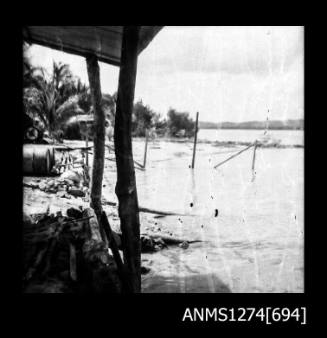 A wooden structure, with wooden beams in the water, on Packe Island