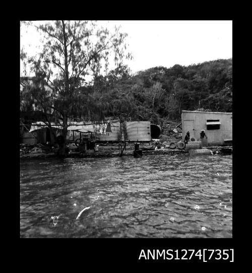 A shed and equipment on the shoreline on Packe Island