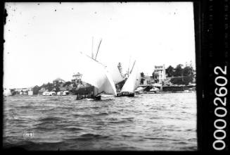 Starboard view of two large open boats sailing off Birchgrove, Sydney Harbour