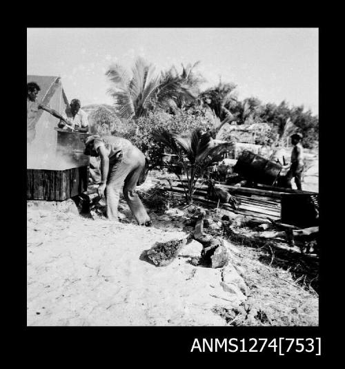 Tarring metal drums on Packe Island, Queensland Pearl Culture Company