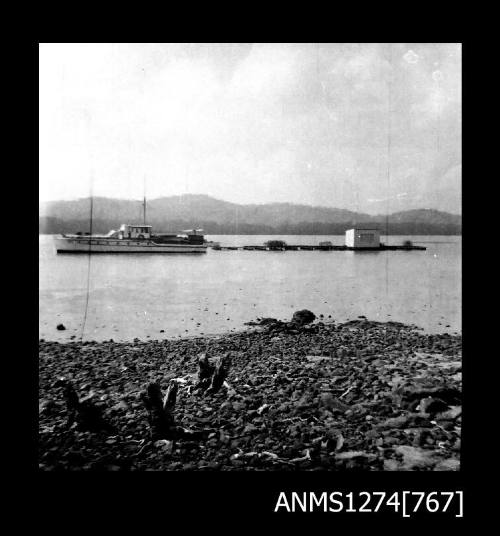 Boat and pearl raft in the water on Packe Island