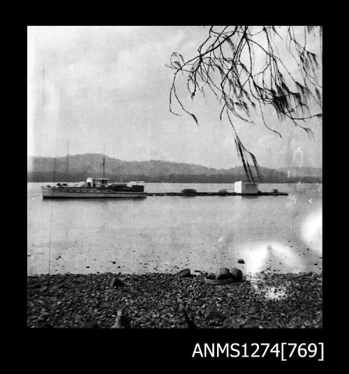 Boat and pearl raft in the water on Packe Island