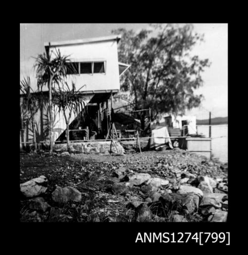 A two storey house on the shoreline on Packe Island