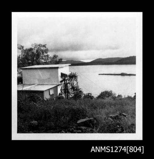 The back of a two storey house on Packe Island, with views of the water