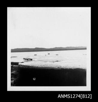 A pearl raft and boats in the water on Packe Island