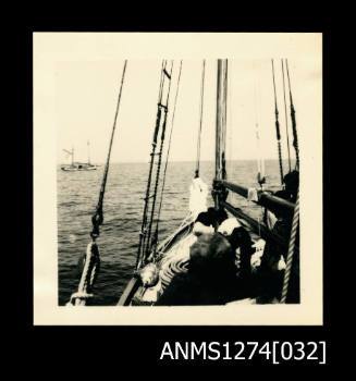 Photograph of several people in a boat in the ocean, on Packe Island