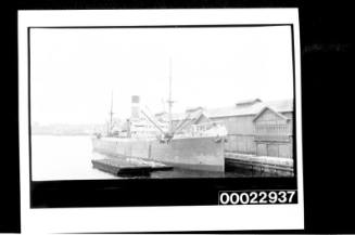 Two-masted ship at wharf