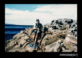 Bob Lynch wearing Dick Charles safety belt and holding fish on a diving trip