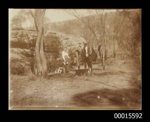 Woman and a man with their horse and dray and dog