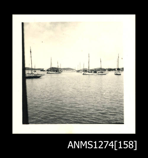 Photograph of several boats in a harbour, on Packe Island