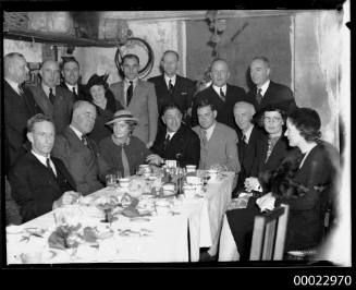 Count Felix Graf von Luckner seated fourth from left at a dinner