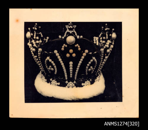 A crown with numerous pearls on it