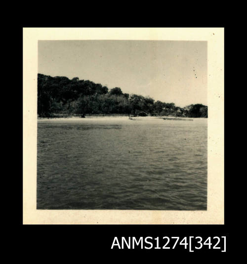 Photograph of land, beach and water on Packe Island