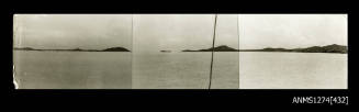 Photograph of land and ocean, taken from a boat, of Possession Island