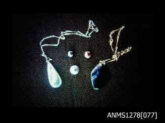 35mm colour transparency of two pearl shell necklaces, and three half pearls (or mabe pearls)
