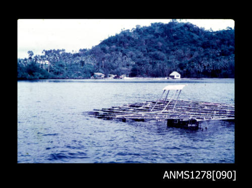 35mm colour transparency of a wooden raft in water