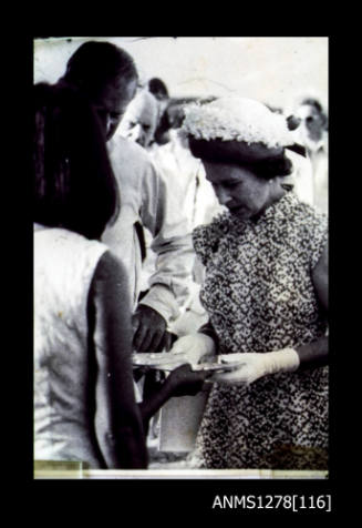 Queen Elizabeth II inspects shells with blister pearls